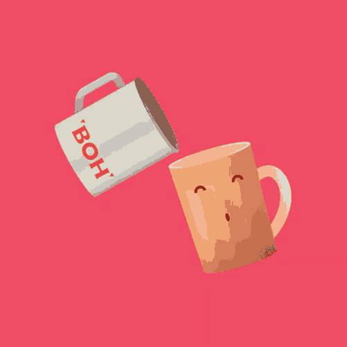 a white cup with the word boh on it is being poured into a brown cup