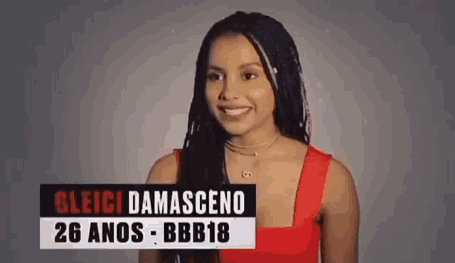 a woman in a red dress is smiling in front of a sign that says gleici damasceno 26 anos - bbb18