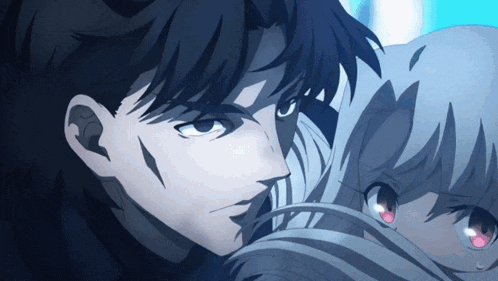 a close up of a man 's face with a woman 's face in the background