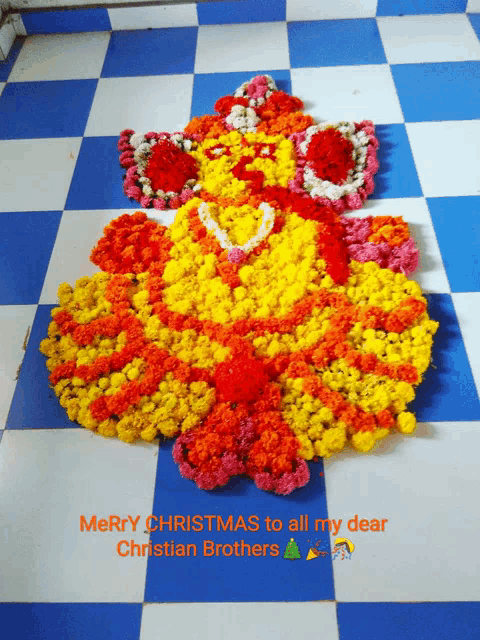 a picture of flowers on a checkered floor with the words merry christmas to all my dear christian brothers above it