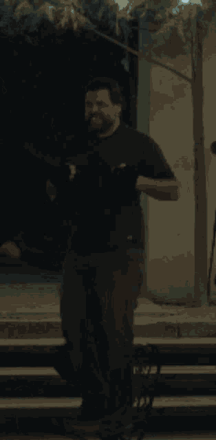 a man is standing in front of a screen that says ' i 'm sorry ' on it