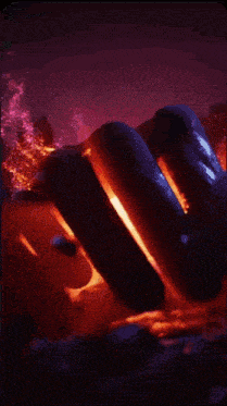a purple and orange background with a blue object floating in the air