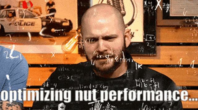a man in front of a blackboard with the words optimizing nut performance written on it