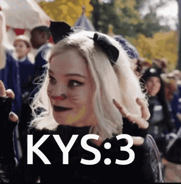 a woman wearing a cat costume with the words kys : 3 on her face