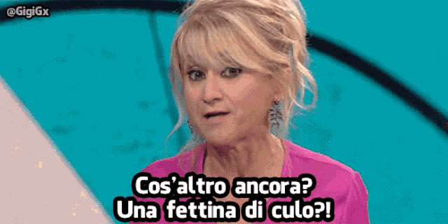 a woman with a surprised look on her face says cos 'altro ancora una fettina di culo