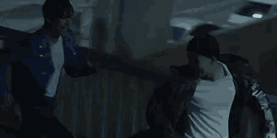 a man and a woman are running across a bridge .