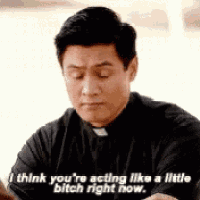 a priest is sitting at a table with his eyes closed and a quote .