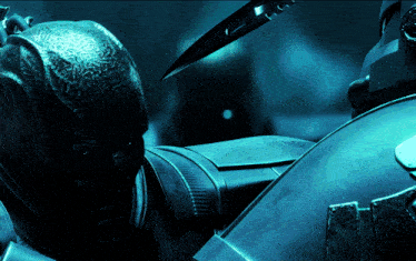 a close up of a person 's helmet with a knife coming out of it