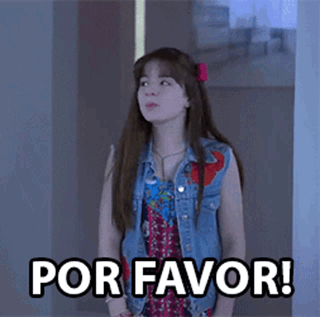 a girl in a denim vest is standing next to a sign that says por favor !