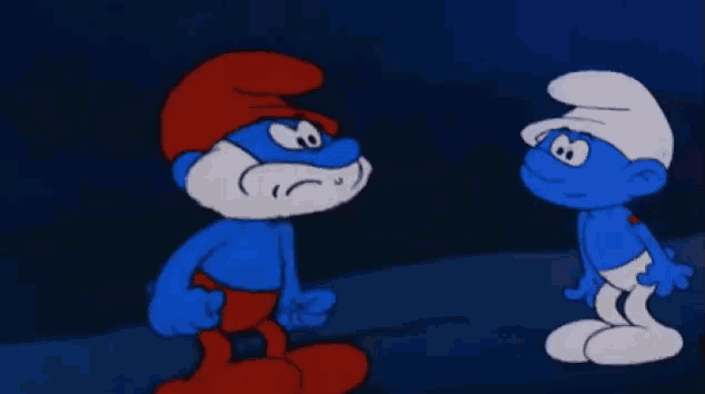 two smurfs are standing next to each other and one has a surprised look on his face