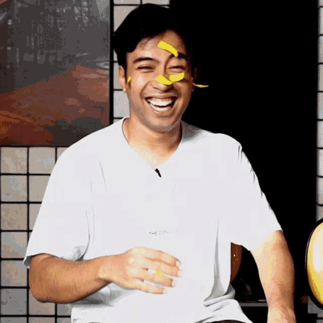 a man wearing a white shirt with the word the on it