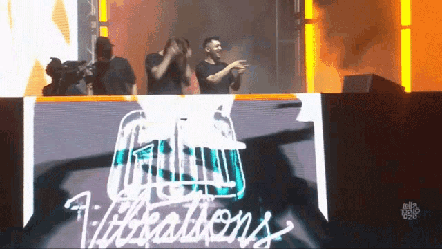 the word vibrations is on a large screen