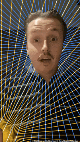 a man with a surprised look on his face is surrounded by rays of light