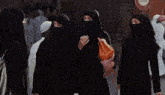 a blurry picture of a woman in a white dress and a man in a black costume .