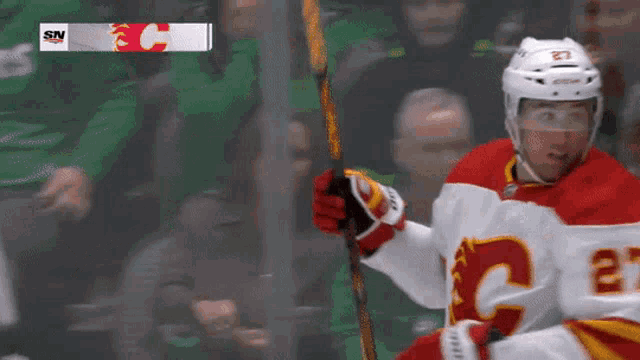 a hockey player with a c on his jersey