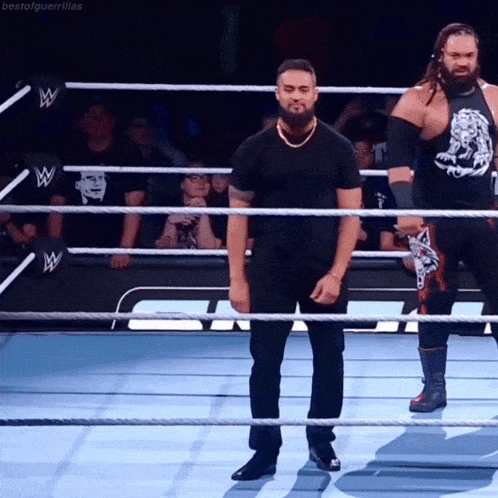 two wrestlers are standing in a wrestling ring with the words bestofguerrillas on the bottom right