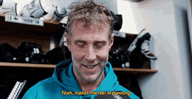 a man wearing a blue hoodie says " yeah makes me feel real young "