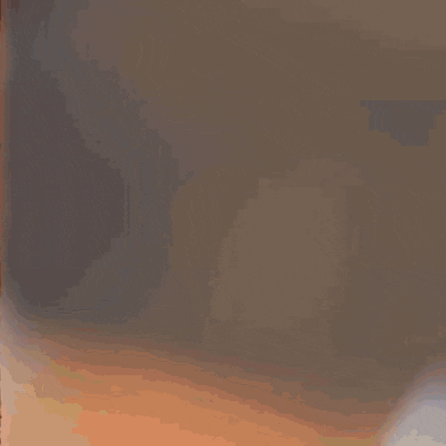 a close up of a man 's face with a blurred background .
