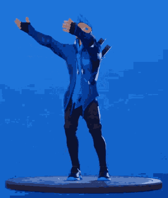 a man in a blue jacket and black pants is standing on a platform with his arms outstretched .