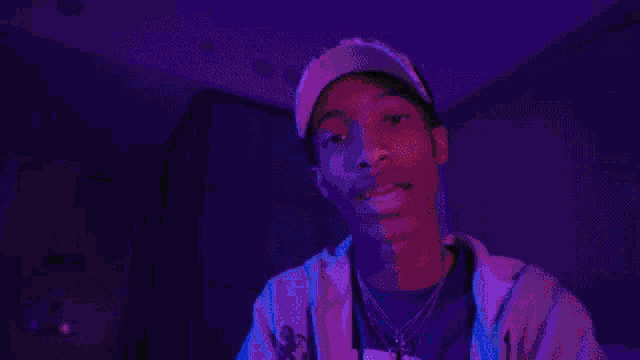 a man wearing a hoodie that says nyu is dancing