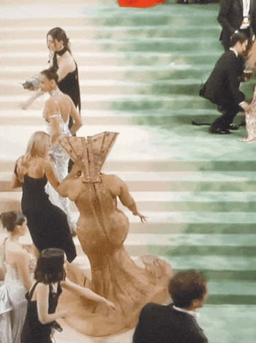 a woman with a fan on her back is surrounded by other people