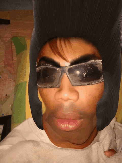 a person wearing sunglasses and a helmet looks like elvis