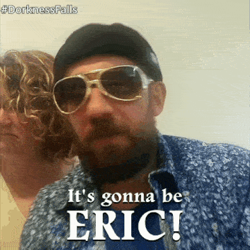 a man wearing sunglasses says it 's gonna be eric in front of a woman