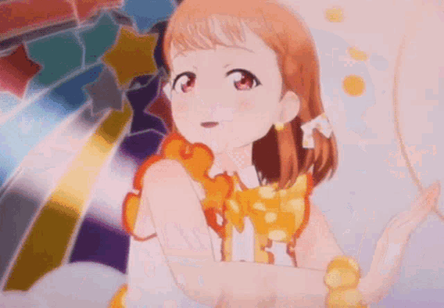 a girl in a yellow dress is standing in front of a colorful background .