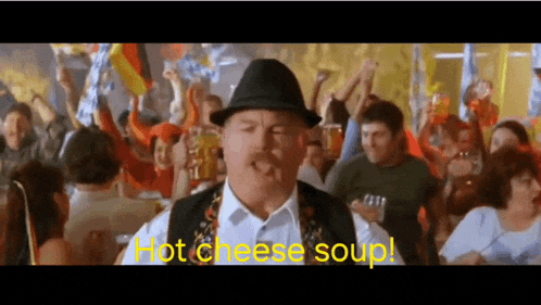 a man in a hat says hot cheese soup