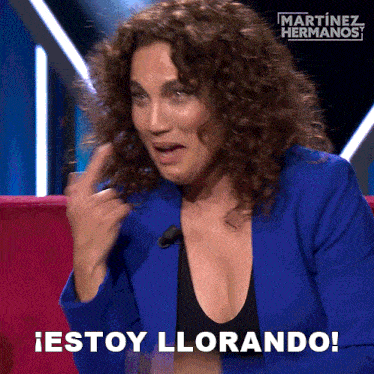 a woman in a blue jacket says " estoy llorando " in spanish