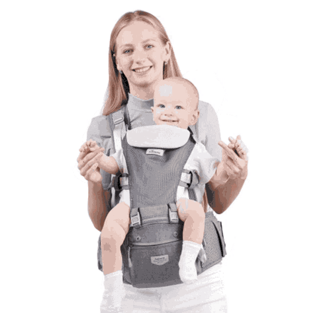 a woman is carrying a baby in a carrier that says ' baby carrier ' on the front