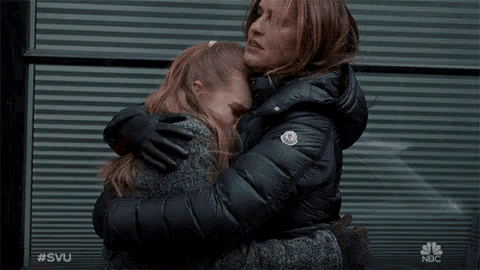 a woman hugging a little girl with the hashtag #svu on the bottom right