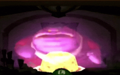 a purple frog is projected on a wall with a yellow object in its mouth .