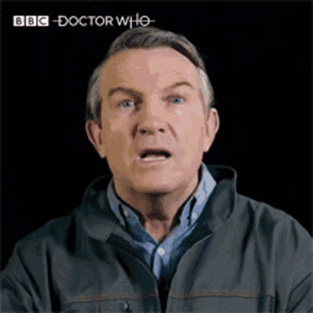 a man in a bbc doctor who jacket is making a face
