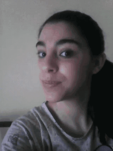 a close up of a woman 's face with her eyes closed