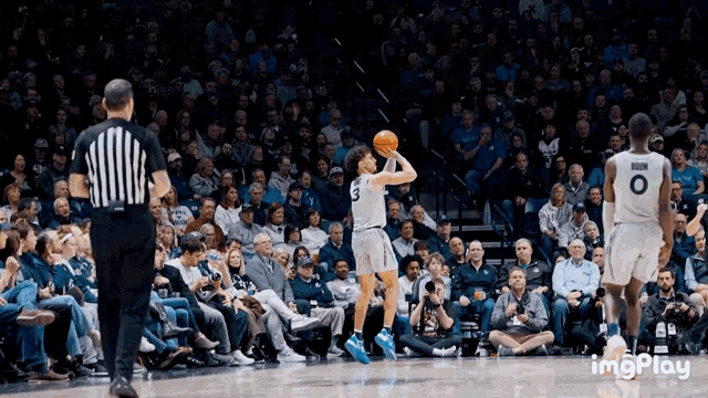 a basketball player with the number 3 on his jersey is about to throw the ball