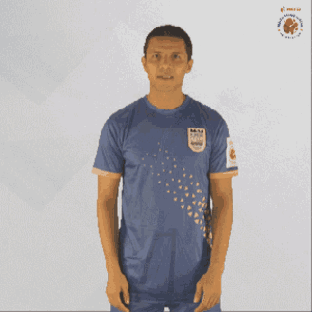 a man wearing a blue shirt that says ipl on the front
