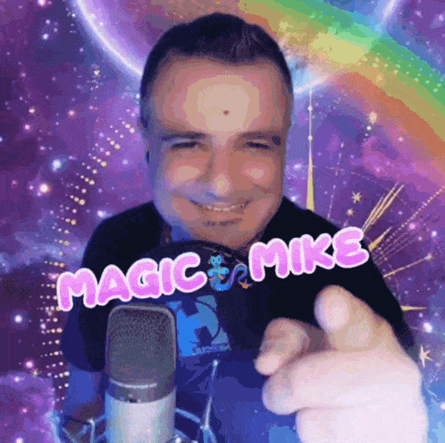 a man in front of a microphone with magic mike written on his shirt