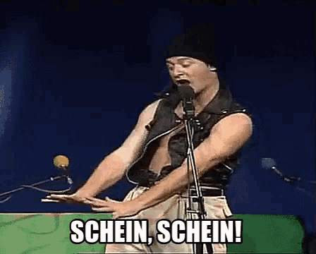 a man singing into a microphone with the words schein schein written on the screen