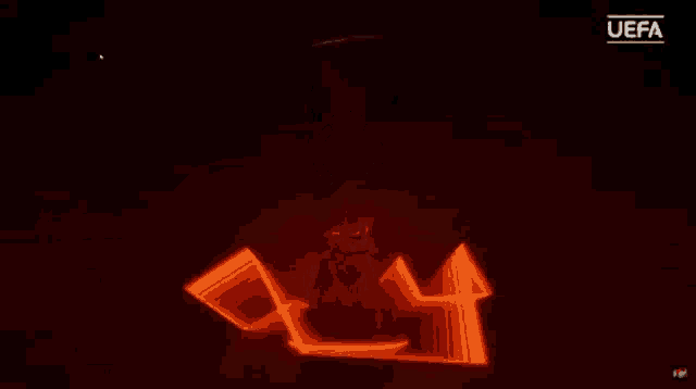 a uefa logo is displayed on a dark background