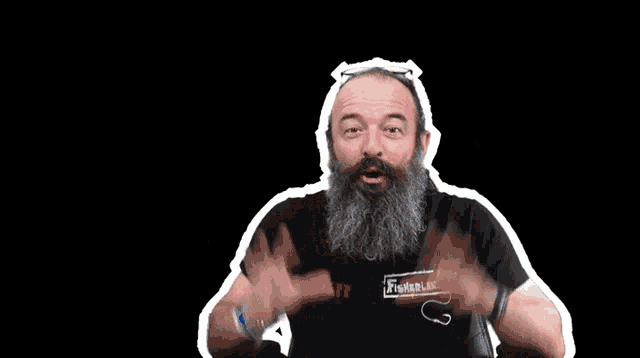a man with a beard is wearing a black shirt that says staff