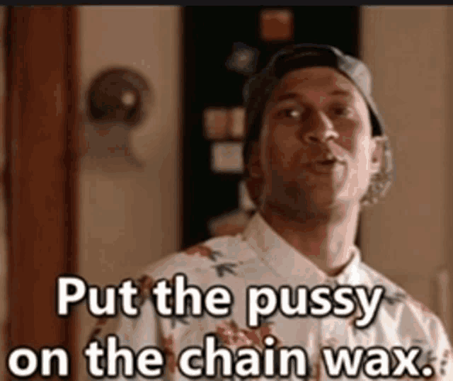 a man wearing a hat and a floral shirt says put the pussy on the chain wax