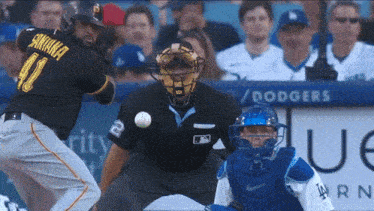 a baseball player named santana is swinging at a ball