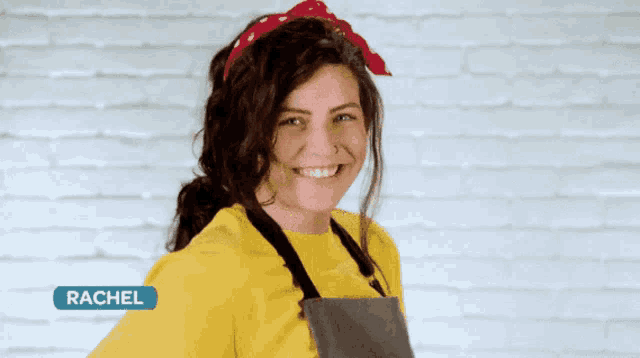 a woman wearing a yellow shirt and apron with the name rachel