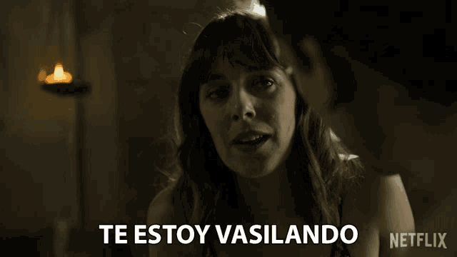 a woman talking to a man with the words te estoy vasilando on the bottom