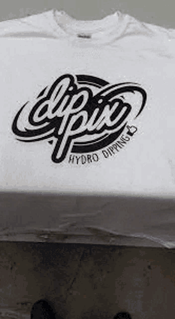 a white t-shirt with a black logo on it .