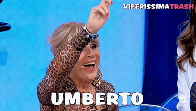 a woman in a leopard print shirt says umberto on the screen