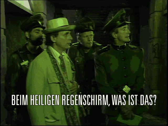 a group of men standing next to each other with the words beim heiligen regenschirm was ist das on the bottom