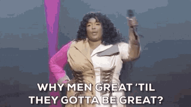 a woman is singing into a microphone and asking why men great 'til they gotta be great ?