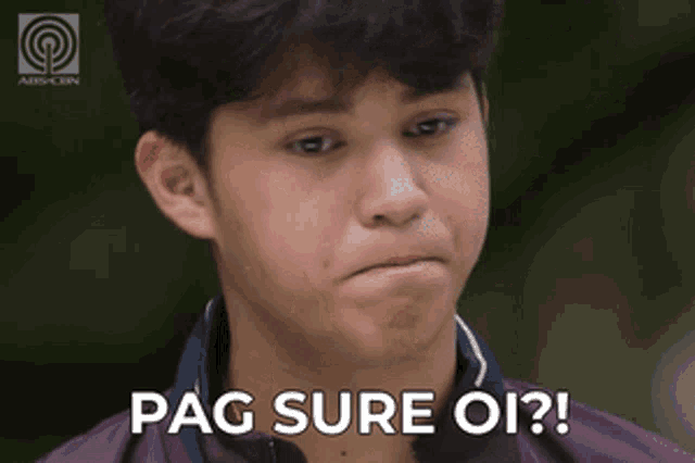 a young man in a purple shirt says pag sure oi !